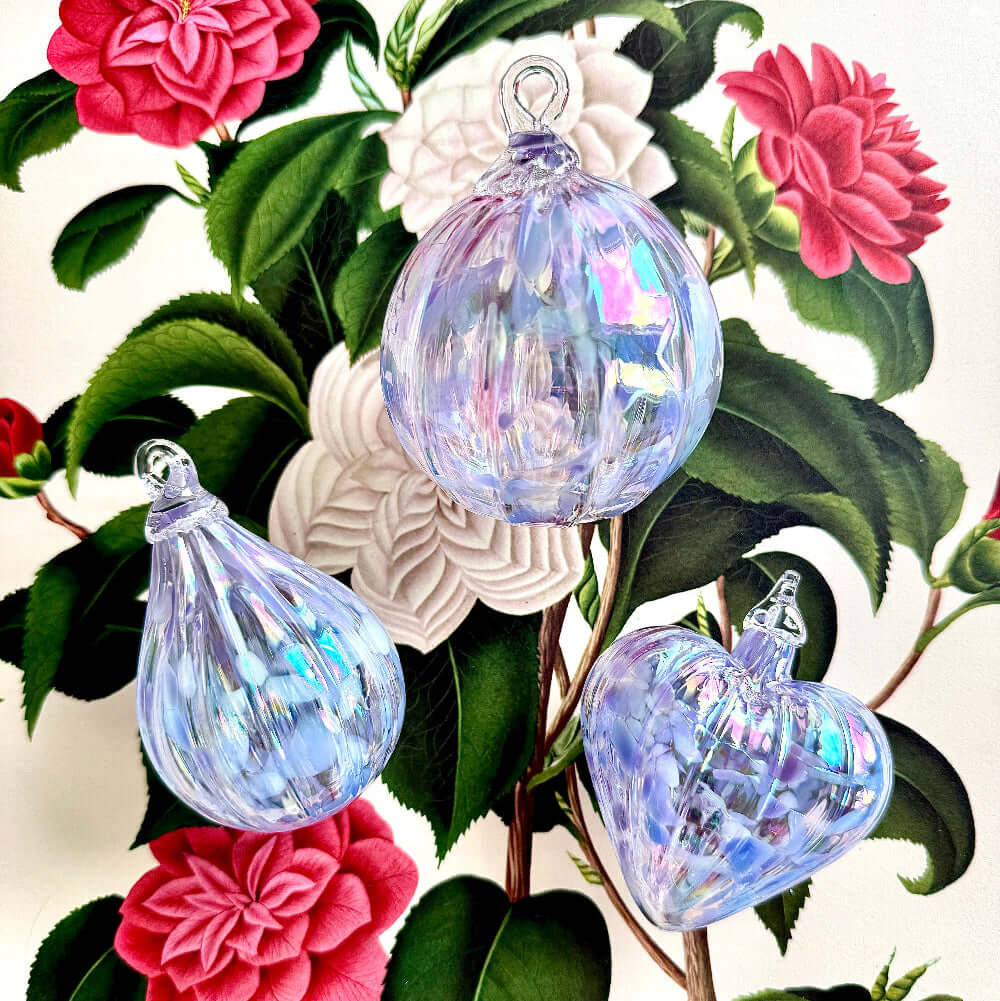 Decorative glass ornaments from the Lacey Collection featuring iridescent colors in a Bellflower design.