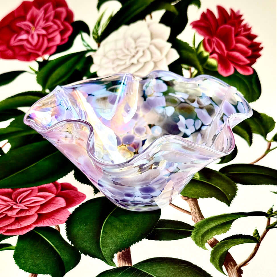 Handmade Bellflower wave bowl with iridescent finish shifting colors of periwinkle and lavender.
