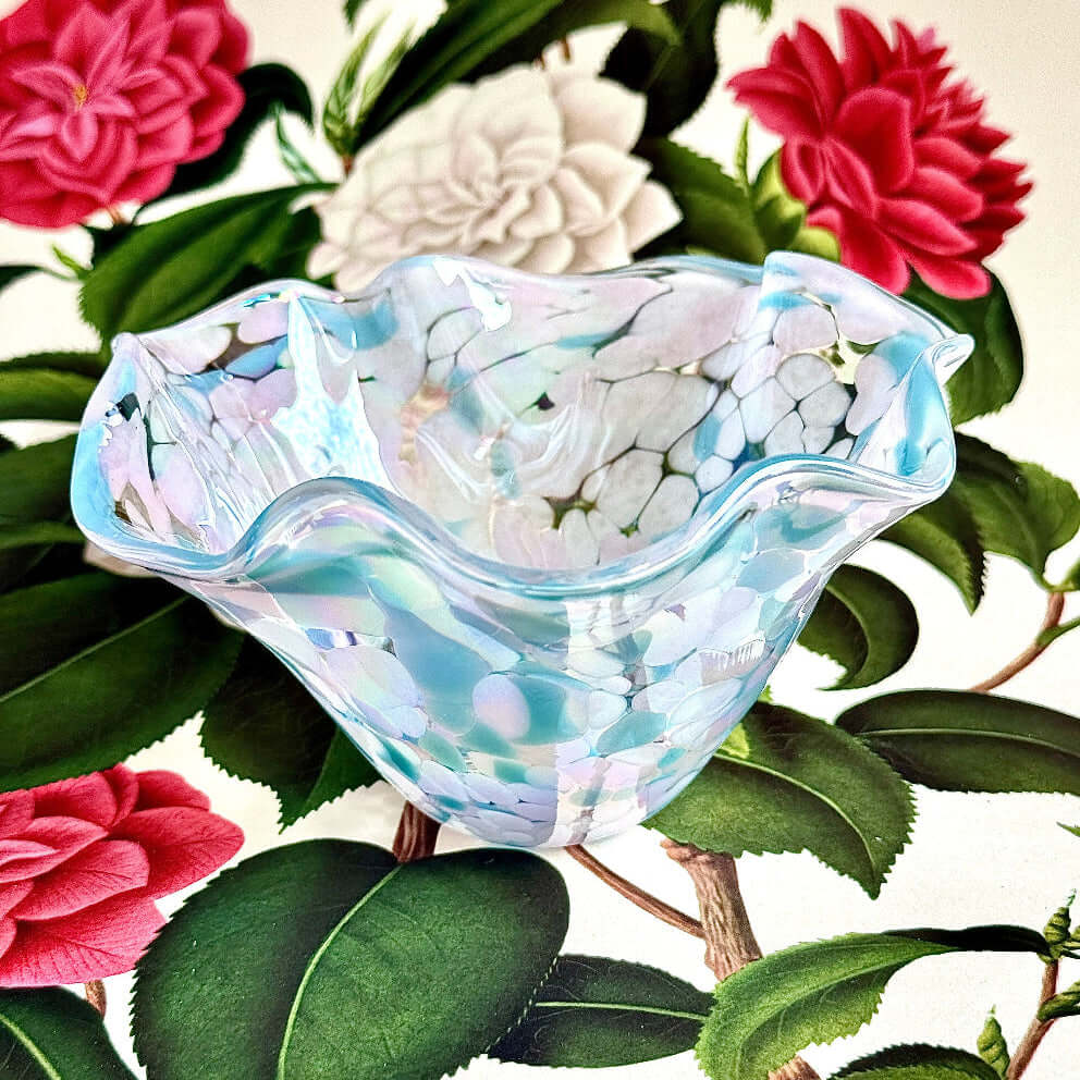 Baby Blue Eyes wave bowl showcasing iridescent blue and lavender finish, part of The Lacey Collection.
