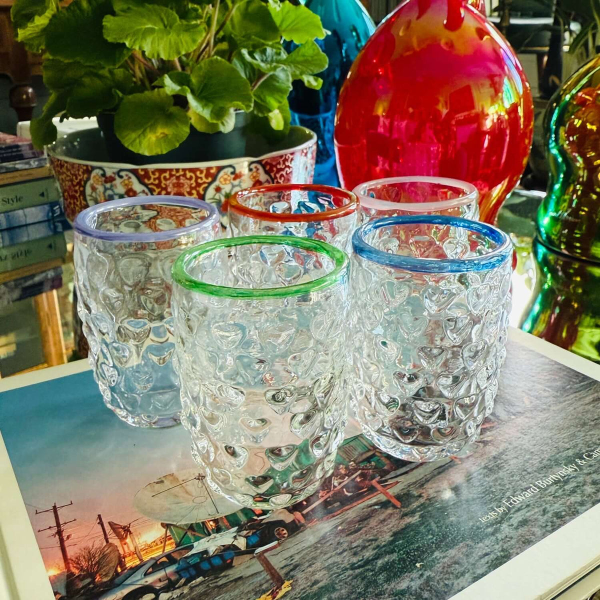 Handmade Glass Ornament: Set of five colorful Love Cups on a coffee table, showcasing their unique heart-embellished design.