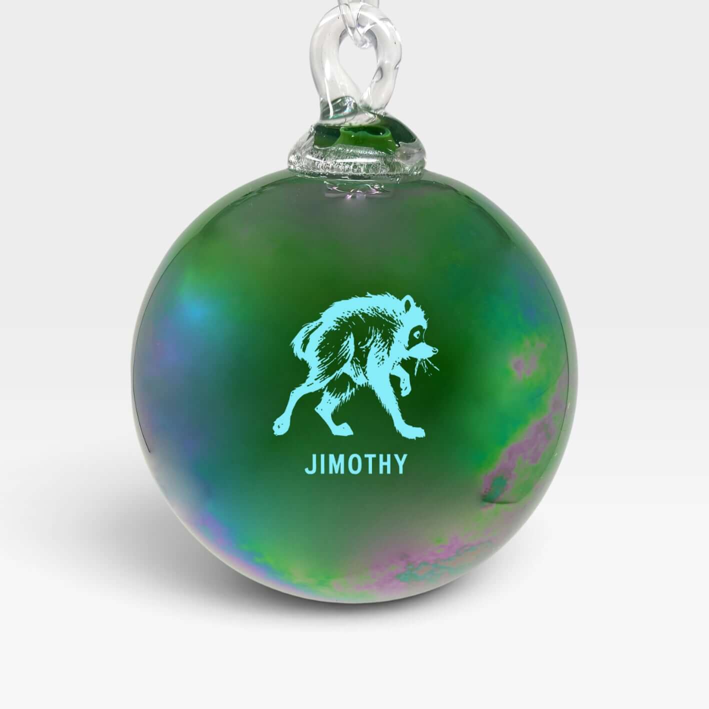 Handblown glass ornament featuring Jimothy, the city's favorite dumpster king, in vibrant green.