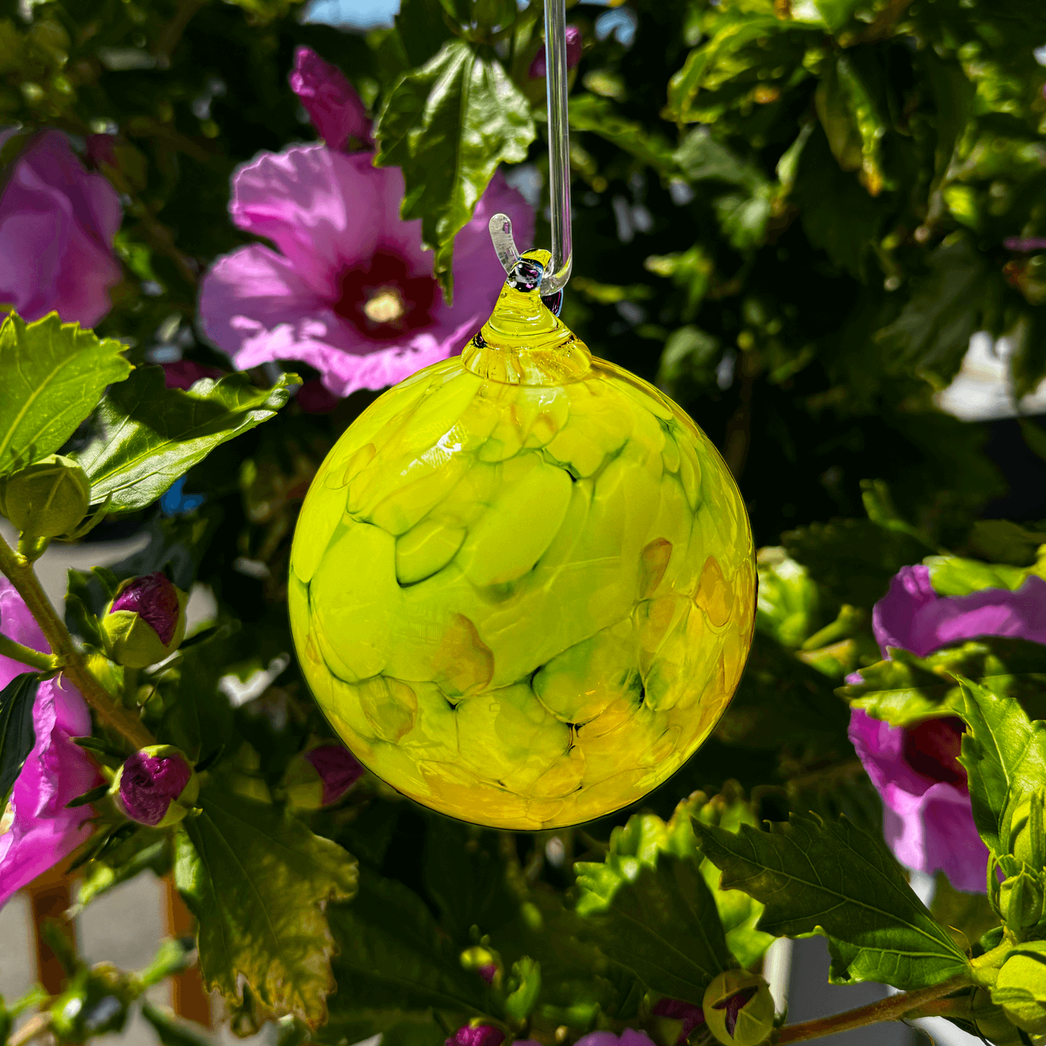 bright yellow round glass ornament